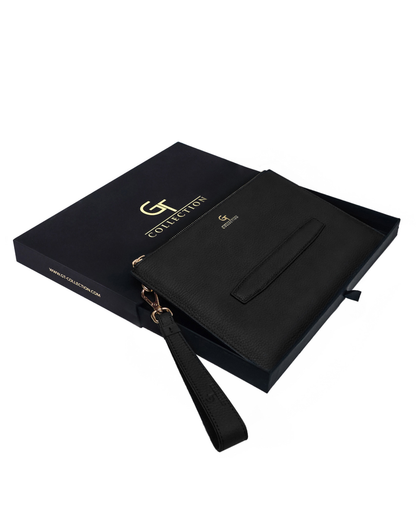 Black leather pouch with front pocket, wrist strap, and gold-tone hardware