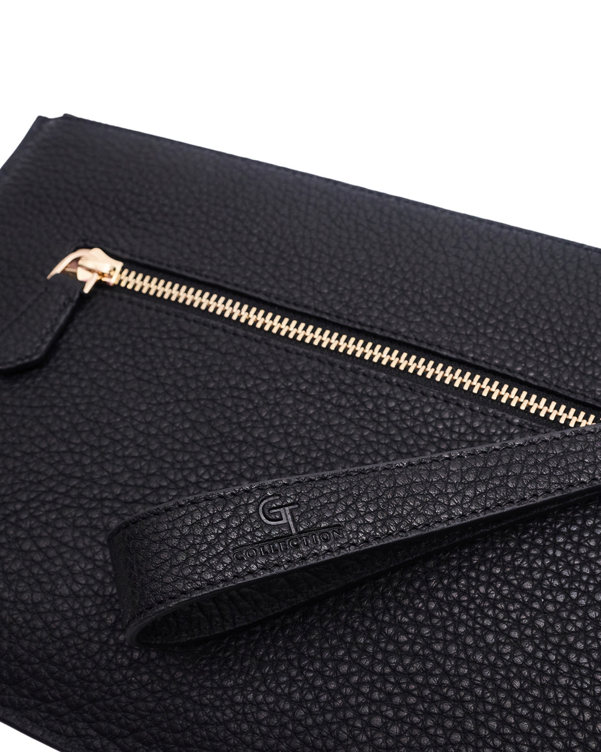 Black pebbled leather pouch close-up with gold-tone zipper pull