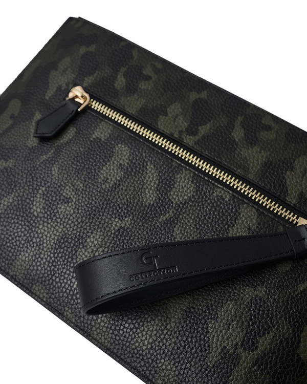 Camouflage leather pouch close-up with gold zipper track and black logo patch