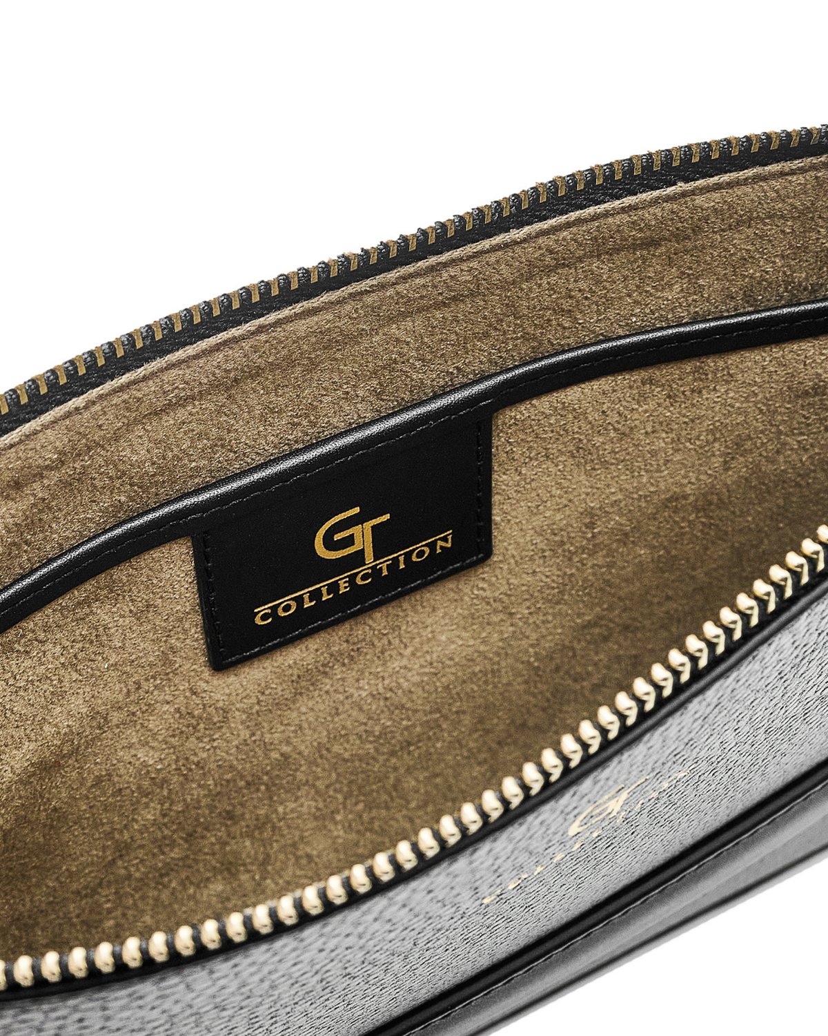 Interior of camouflage pouch with black trim and gold-tone zipper edge