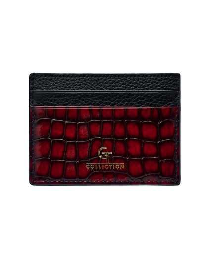 Red croc-embossed leather card holder with textured black top and gold logo.