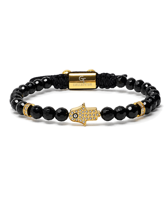 Black bead bracelet with gold Hamsa charm and gold accent beads, macrame center.