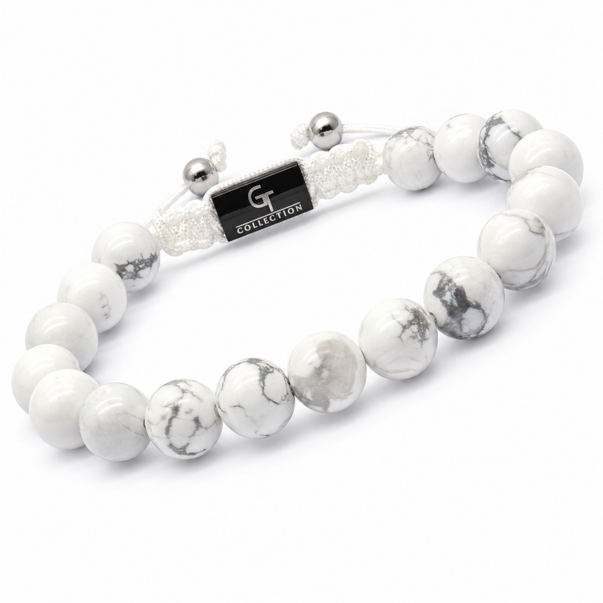 White howlite bead bracelet with G Collection tag and silver cord ends, side view