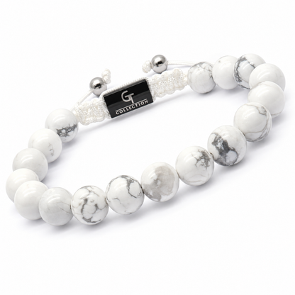 White howlite bead bracelet with G Collection tag and silver cord ends, side view
