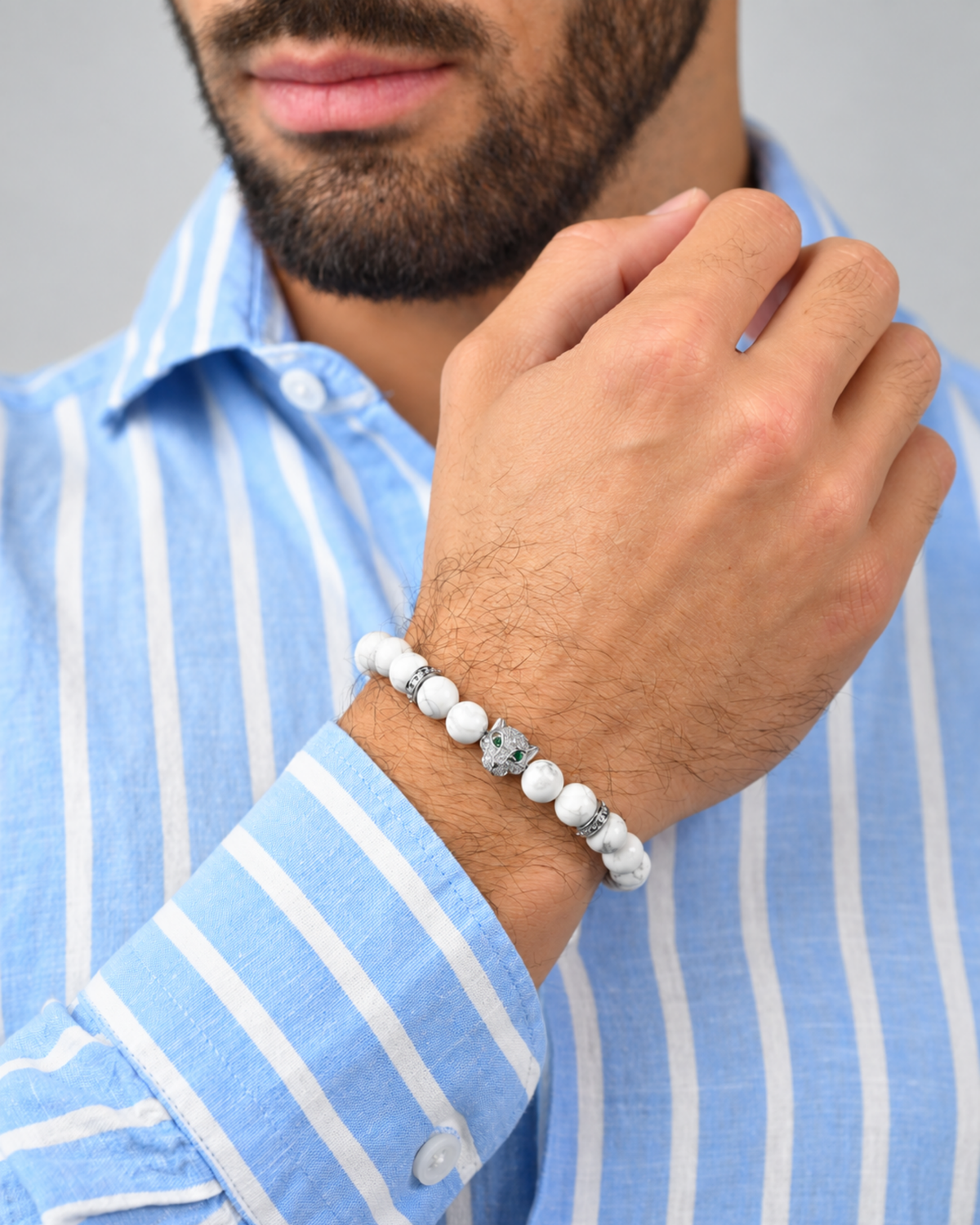 White howlite bead bracelet worn on wrist with silver bead details