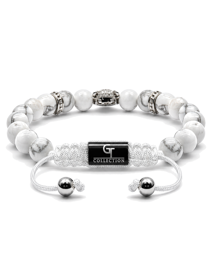White howlite bead bracelet with silver leopard-style centerpiece and charm accents