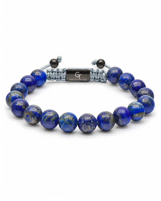 Blue lapis lazuli bead bracelet with gray cord and engraved center plate detail