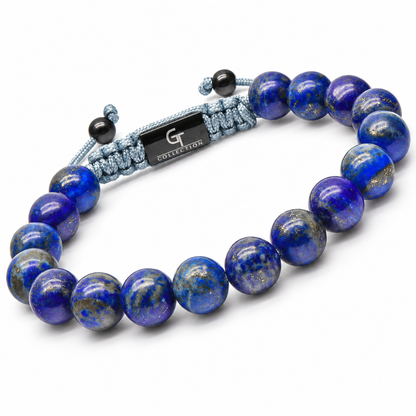 Lapis lazuli beaded bracelet with blue round beads and gray adjustable cord centerpiece