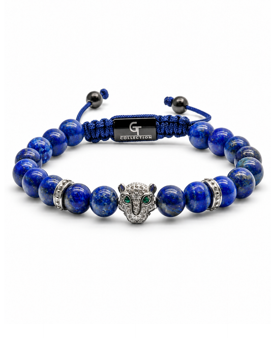Lapis lazuli bead bracelet with blue cord center label and animal-head charm