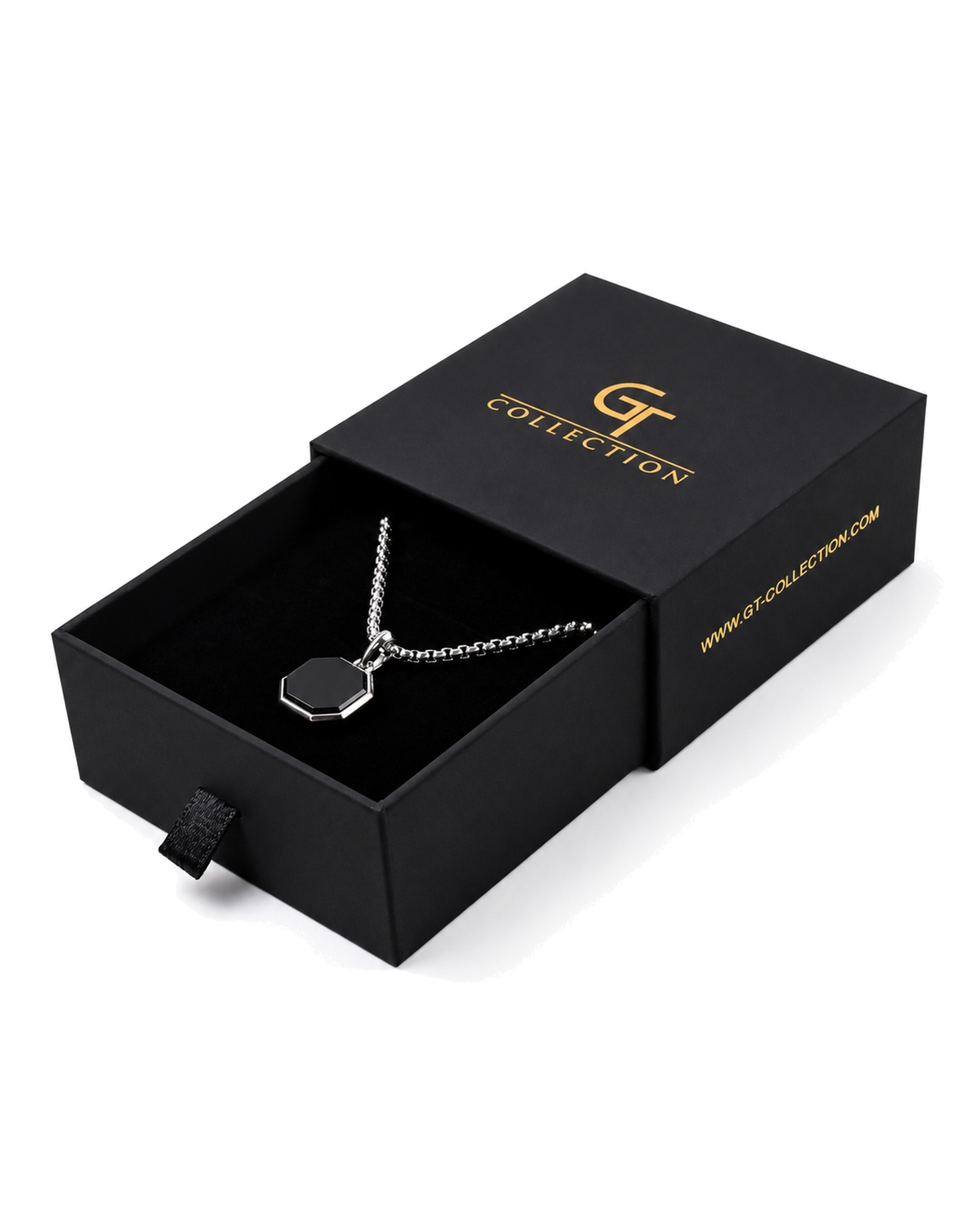 Octagonal pendant necklace resting in a black gift box with chain and charm