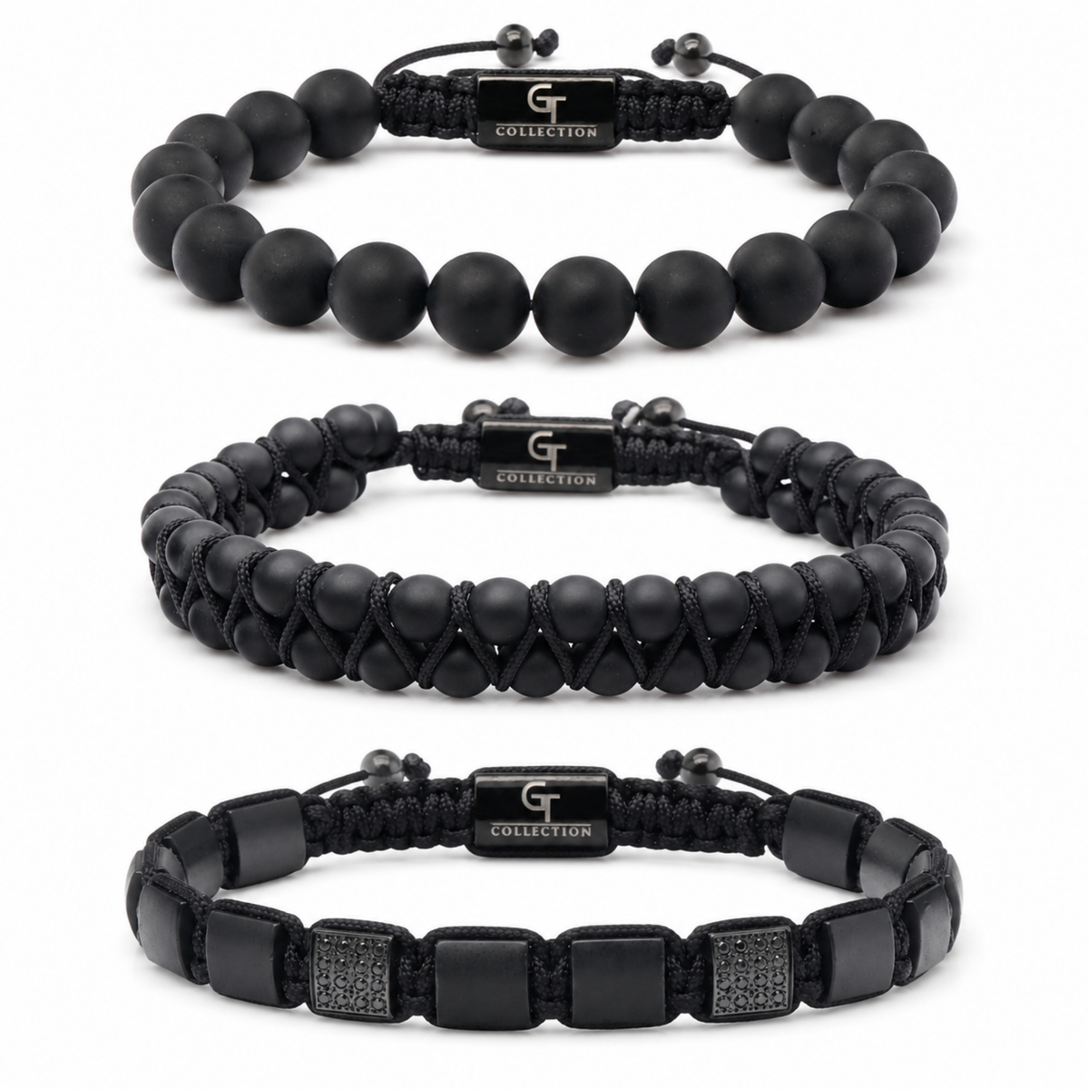 Three black bracelets: matte bead, braided cord, and leather strap with studs