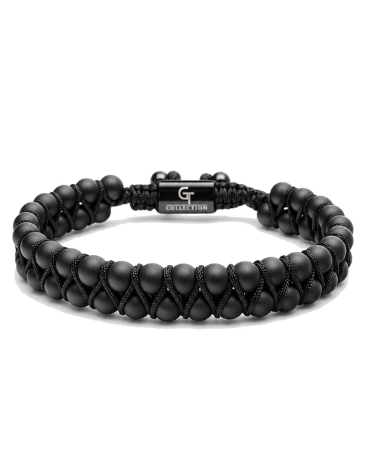 Black double-row beaded bracelet with black cord tie and G Collection metal centerpiece