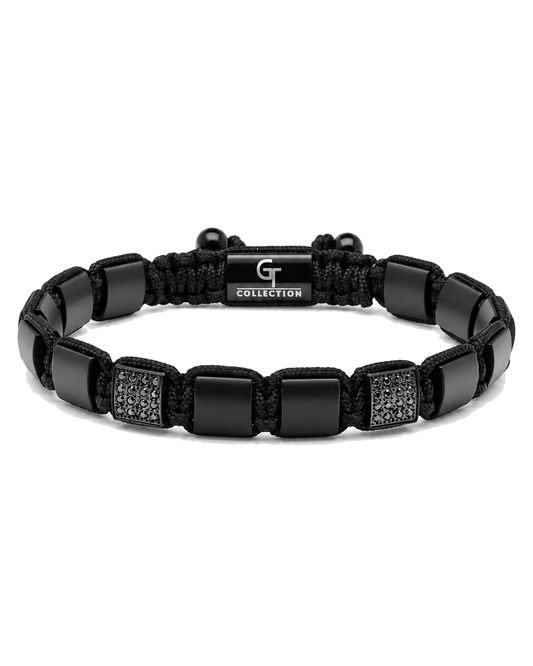 Black bead bracelet with braided rope, square links, and engraved "G COLLECTION" plate