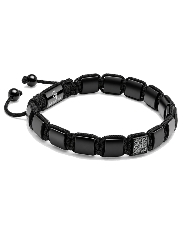 Black beaded bracelet with braided cord, square bead segments, and engraved plate detail