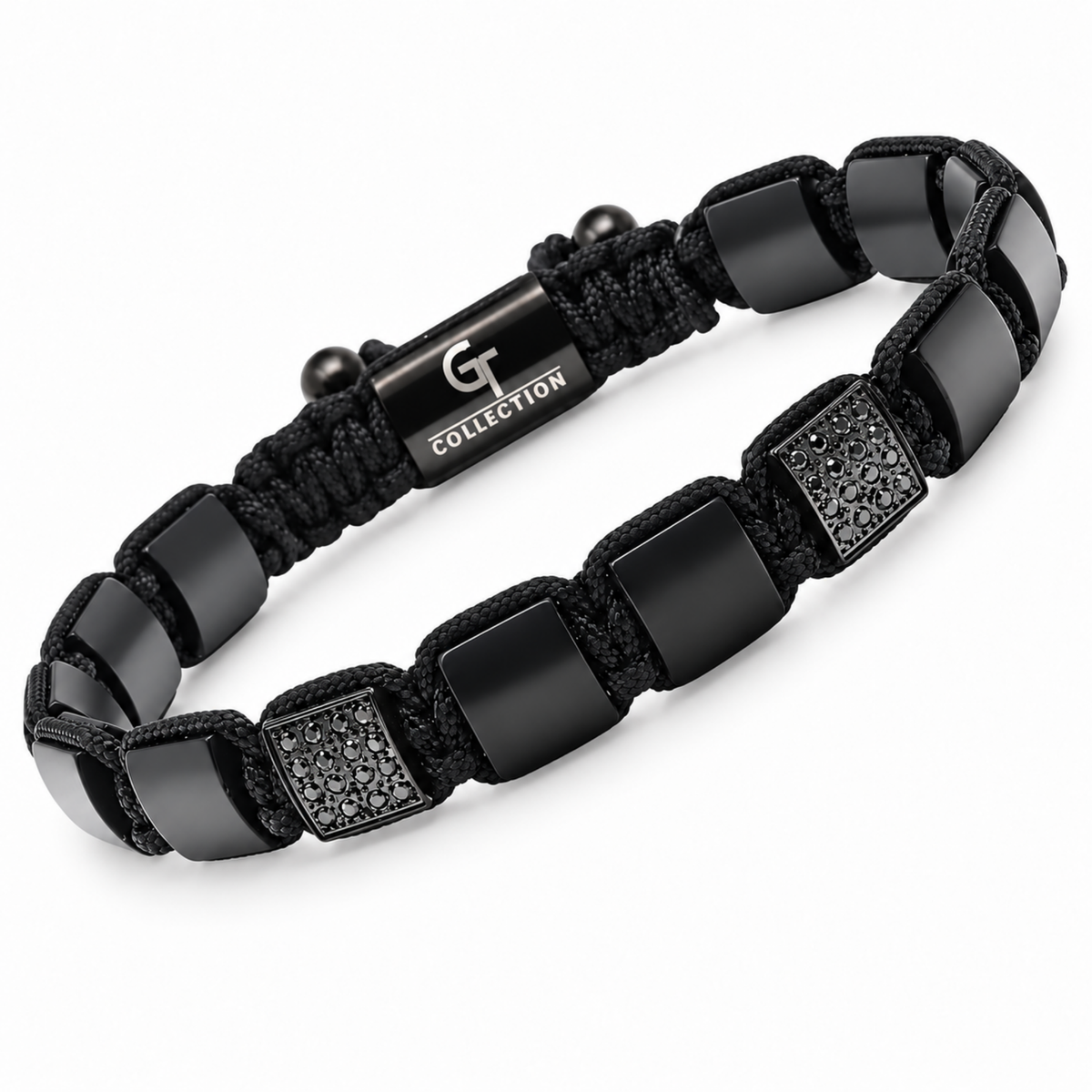 Close-up of black bead bracelet with flat spacers and textured centerpiece blocks