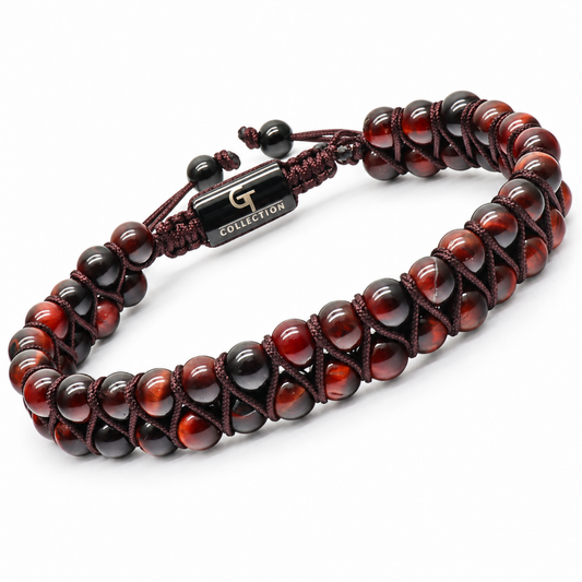 Close-up of tiger eye bead bracelet with black spacers, braided cord, metal G charm