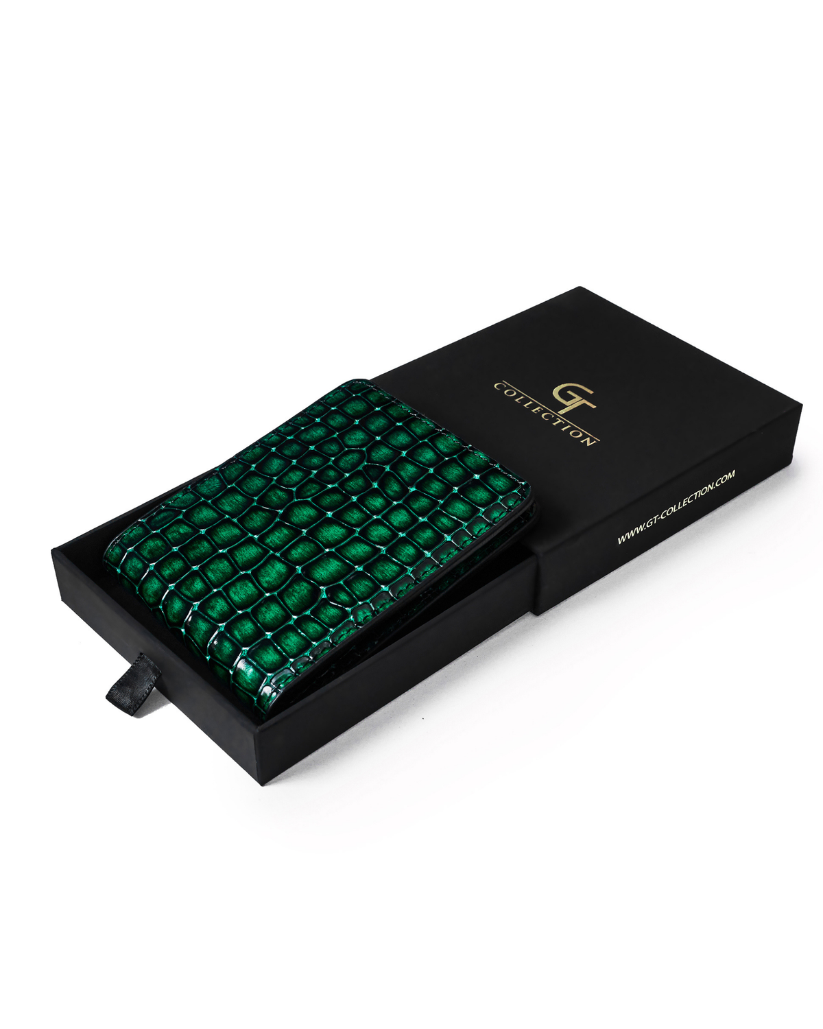 Green croc-embossed leather wallet on a black gift box, closed.