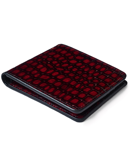Red croc-embossed leather card wallet, slim profile with curved edges and stitching.